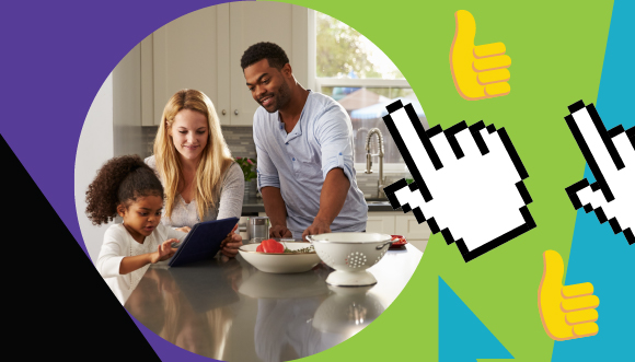 a family in a kitchen looking at a tablet