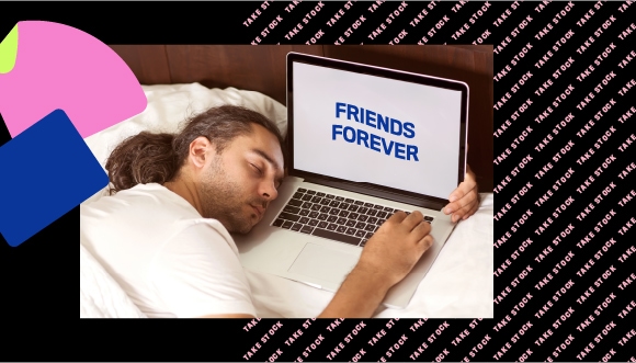 a person sleeping next to a laptop, which has text "friends forever" on screen